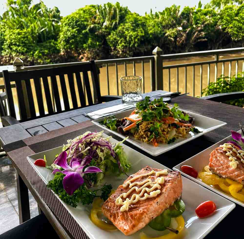 Vietnamese breakfast served on the terrace overlooking the river